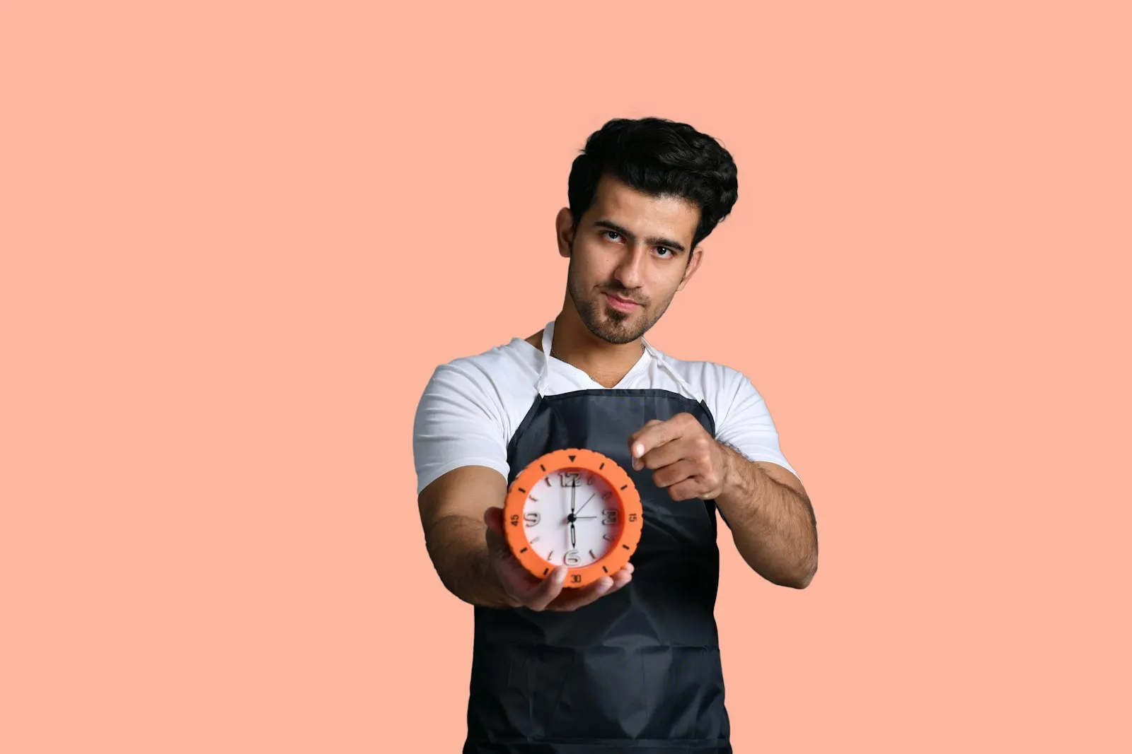 Person holding a clock representing overtime and payroll compliance