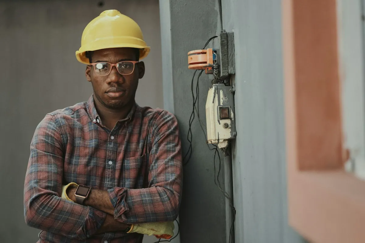 HVAC technician working with tools at a service location