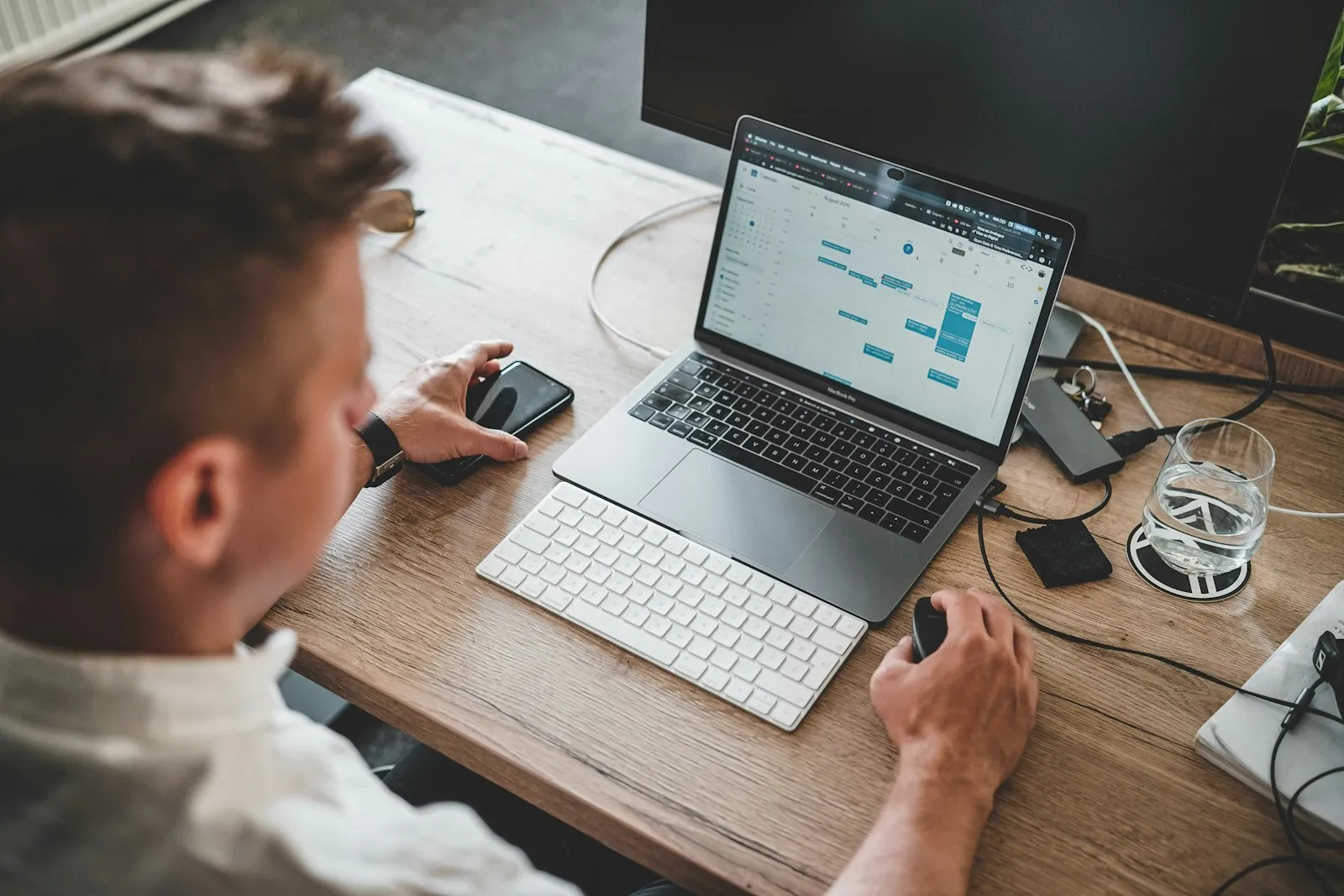 Business owner analyzing financial data on laptop at office desk