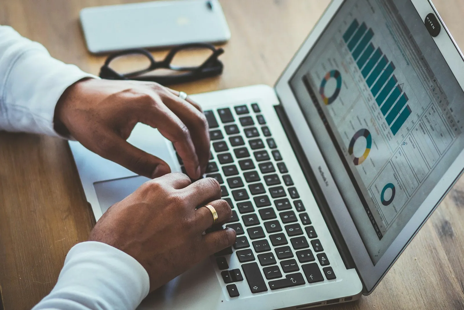 Business owner reviewing digital marketing analytics on laptop screen