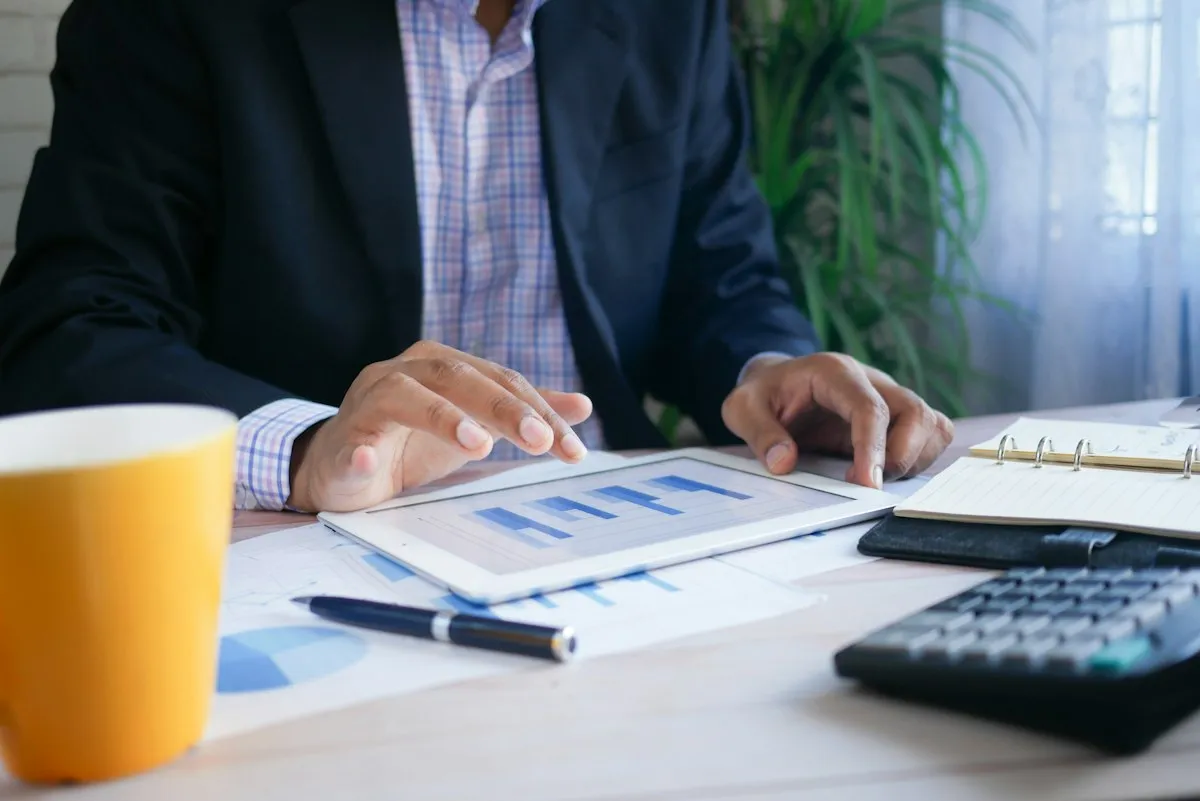 Accountant analyzing financial spreadsheet data on a computer screen