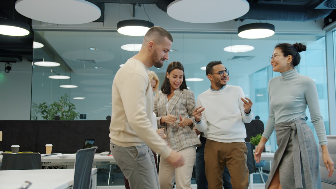 Small team meeting in an HVAC shop — the all-hands that sets the tone