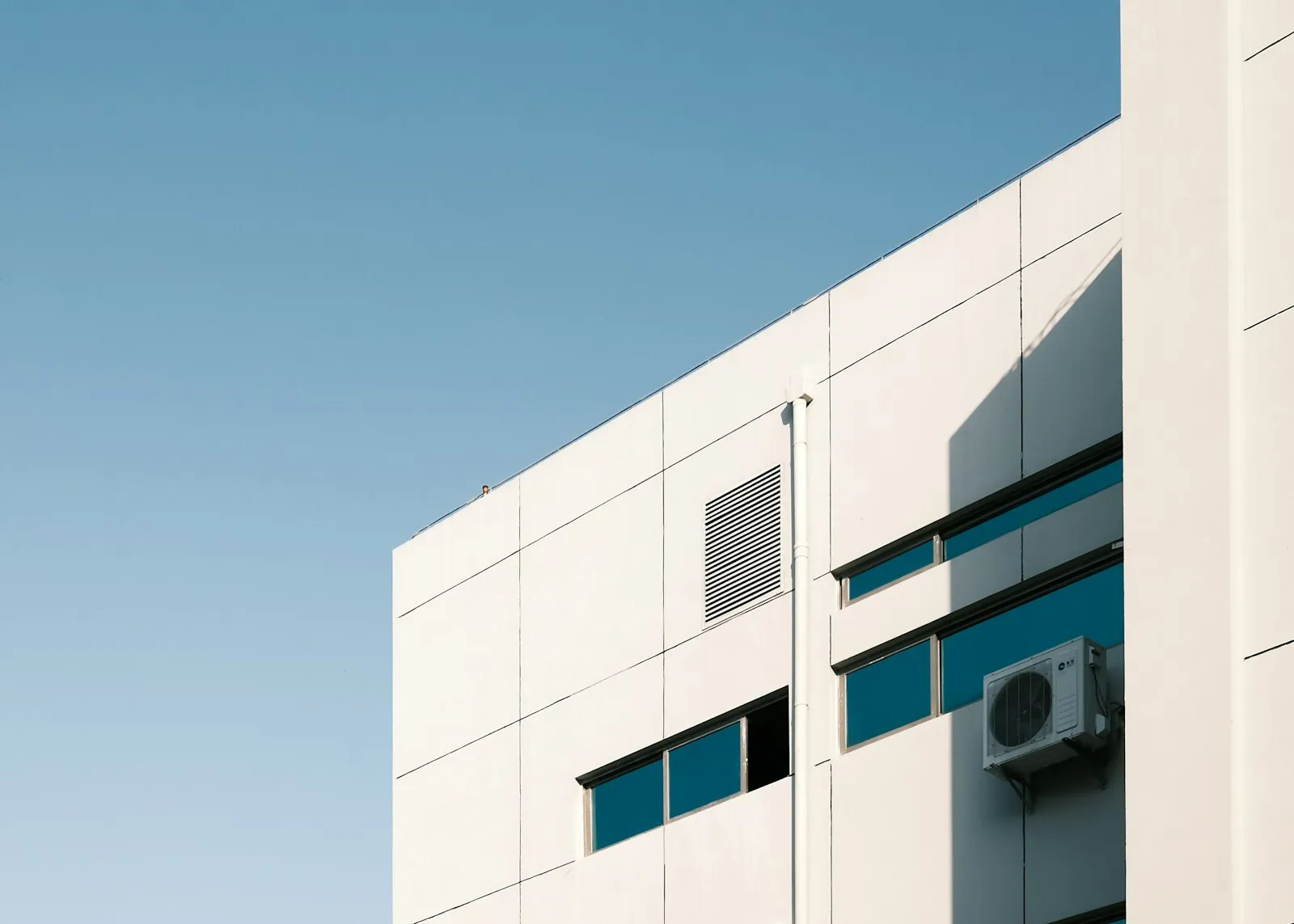 Commercial HVAC building representing combined business and real estate acquisition